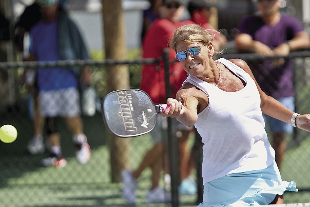 4. Liz Fitton rips a forehand. She won the 3.5 Women’s Doubles and Mixed Doubles..tif